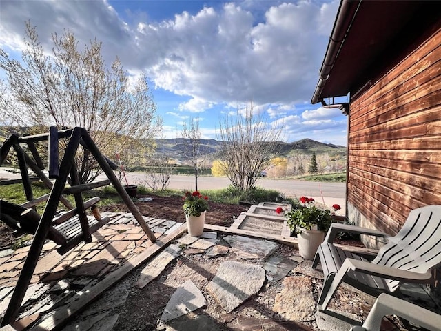 158 Oak Ridge Cir, Oak Creek, CO 80467 - view of patio / terrace with a mountain view