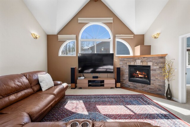 481 Marmot Cir, Silverthorne, CO 80498 - carpeted living area featuring a fireplace, vaulted ceiling, and baseboards