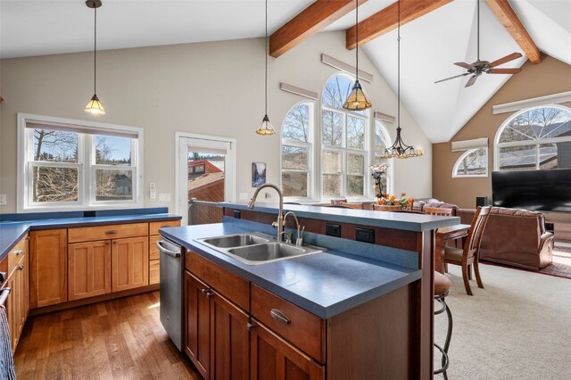 481 Marmot Cir, Silverthorne, CO 80498 - kitchen with dark countertops, dishwasher, a sink, and open floor plan