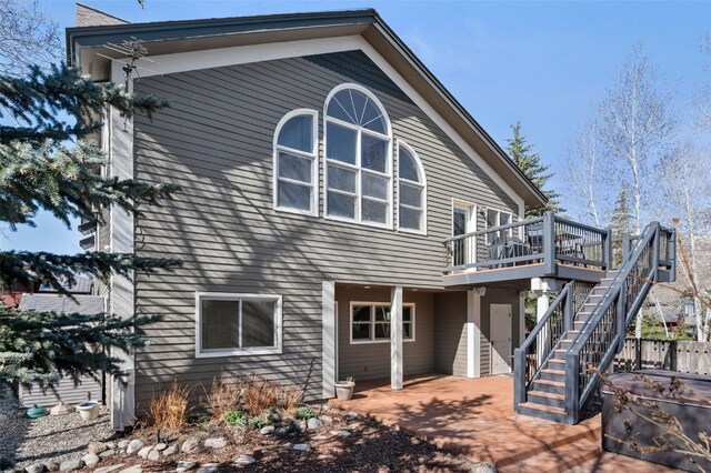 481 Marmot Cir, Silverthorne, CO 80498 - rear view of house with stairway, a deck, and a patio area