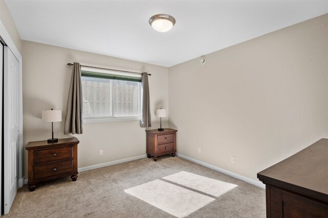 481 Marmot Cir, Silverthorne, CO 80498 - bedroom featuring baseboards, light carpet, and a closet
