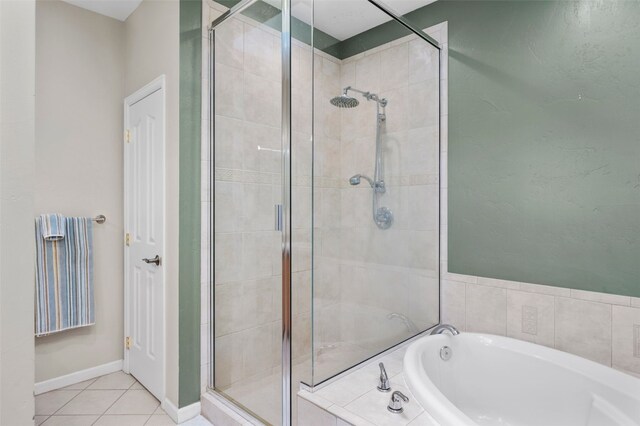 481 Marmot Cir, Silverthorne, CO 80498 - bathroom with baseboards, a shower stall, tile patterned flooring, and a bath