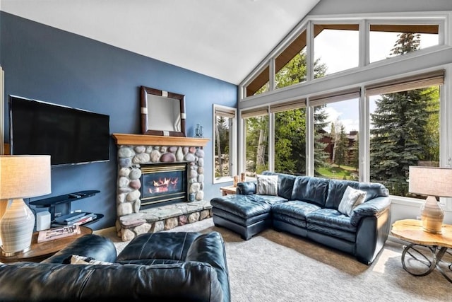 2840 Kitzbuhel Ct Unit 2, Steamboat Springs, CO 80487 - carpeted living area featuring plenty of natural light, lofted ceiling, and a fireplace
