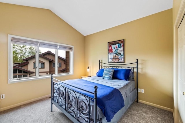 2840 Kitzbuhel Ct Unit 2, Steamboat Springs, CO 80487 - bedroom featuring carpet flooring, vaulted ceiling, and baseboards
