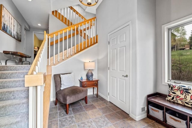 2840 Kitzbuhel Ct Unit 2, Steamboat Springs, CO 80487 - staircase with baseboards, recessed lighting, and a chandelier