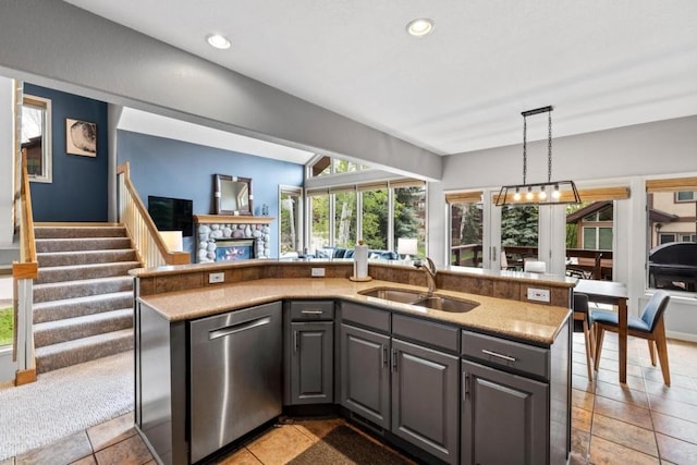 2840 Kitzbuhel Ct Unit 2, Steamboat Springs, CO 80487 - kitchen with a sink, stainless steel dishwasher, open floor plan, plenty of natural light, and recessed lighting