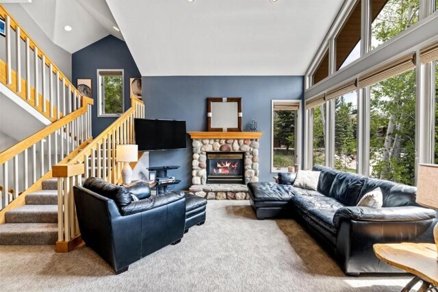 2840 Kitzbuhel Ct Unit 2, Steamboat Springs, CO 80487 - living area featuring carpet flooring, a fireplace, stairway, lofted ceiling, and recessed lighting