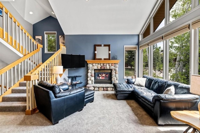 2840 Kitzbuhel Ct Unit 2, Steamboat Springs, CO 80487 - carpeted living area with a fireplace, stairway, recessed lighting, and vaulted ceiling