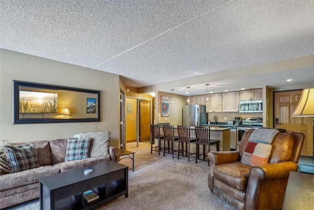 living room with light carpet and a textured ceiling