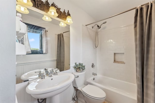 336 N Chipmunk Cir, Silverthorne, CO 80498 - bathroom featuring shower / bathtub combination with curtain and wainscoting