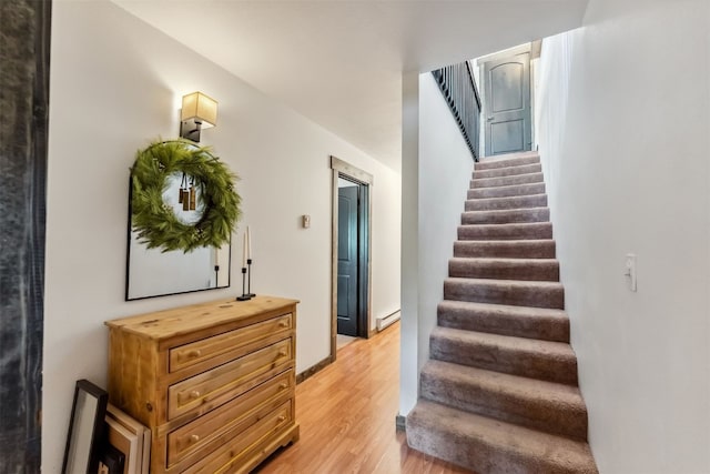 336 N Chipmunk Cir, Silverthorne, CO 80498 - stairs with wood finished floors and a baseboard heating unit