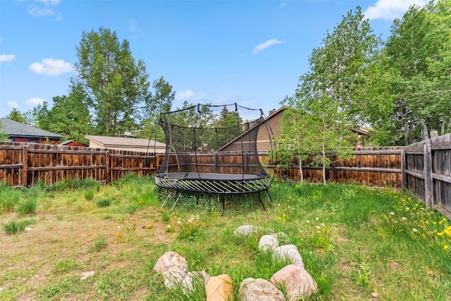 336 N Chipmunk Cir, Silverthorne, CO 80498 - fenced backyard featuring a trampoline
