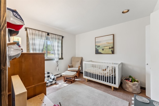 336 N Chipmunk Cir, Silverthorne, CO 80498 - carpeted bedroom featuring a crib and baseboard heating