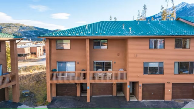 723 Meadow Creek Dr Unit B, Frisco, CO 80443 - view of property featuring a mountain view, a garage, and driveway