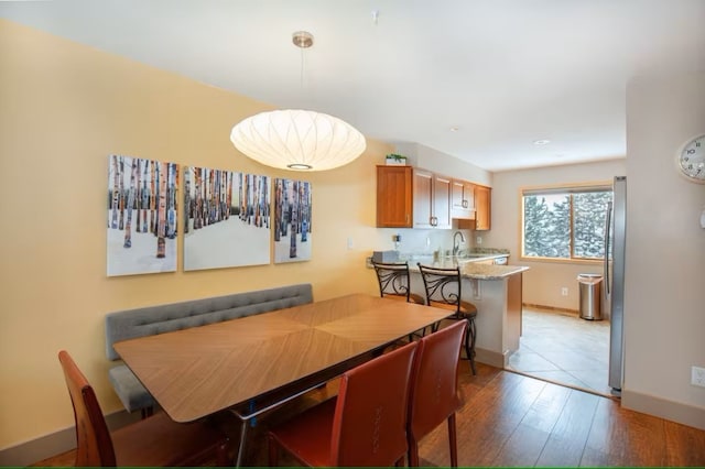723 Meadow Creek Dr Unit B, Frisco, CO 80443 - dining space featuring wood finished floors and baseboards