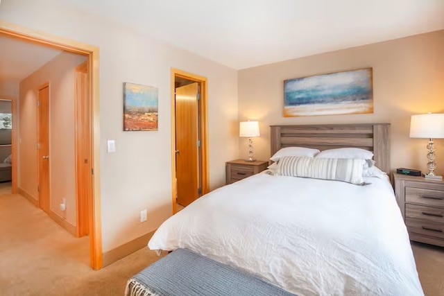 723 Meadow Creek Dr Unit B, Frisco, CO 80443 - bedroom with light carpet and baseboards