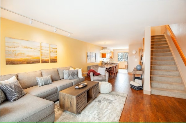723 Meadow Creek Dr Unit B, Frisco, CO 80443 - living room with track lighting, hardwood / wood-style floors, and stairs