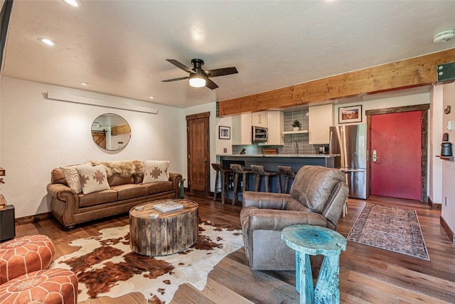 2235 Storm Meadows Dr Unit 312, Steamboat Springs, CO 80477 - living room with a ceiling fan, wood finished floors, recessed lighting, and baseboards
