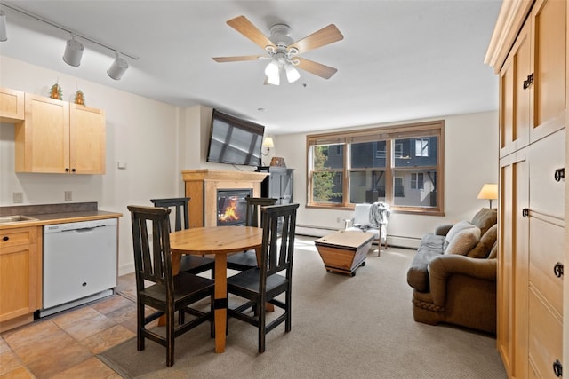 140 Ida Belle Dr Unit 8161, Keystone, CO 80435 - dining area with ceiling fan, a glass covered fireplace, baseboard heating, and track lighting