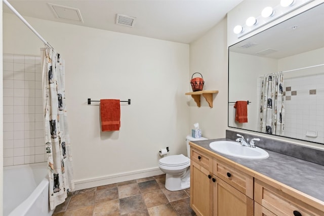 140 Ida Belle Dr Unit 8161, Keystone, CO 80435 - bathroom with vanity, toilet, shower / bath combo with shower curtain, baseboards, and stone finish floors