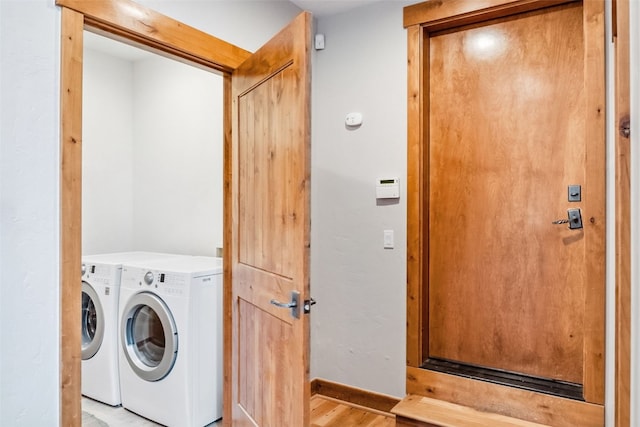 180 Emmett Lode Rd, Breckenridge, CO 80424 - clothes washing area with independent washer and dryer, light wood-type flooring, and baseboards