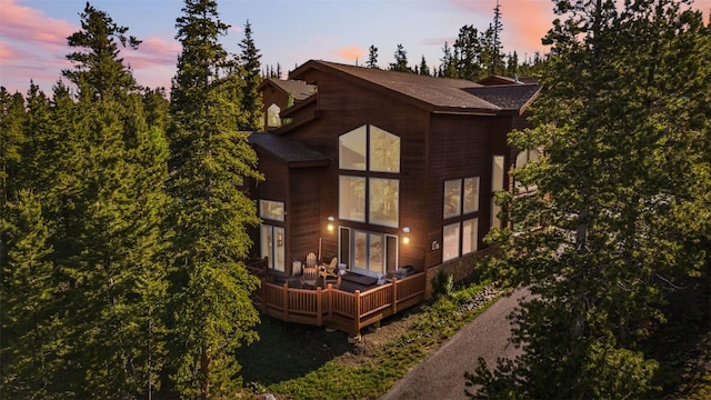 180 Emmett Lode Rd, Breckenridge, CO 80424 - property exterior at dusk with a shingled roof and a deck