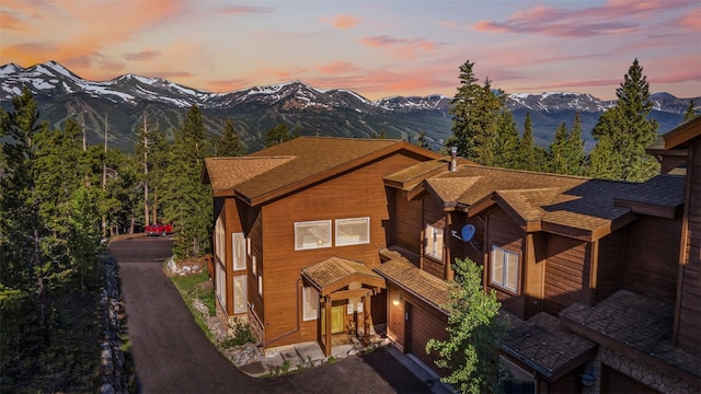 180 Emmett Lode Rd, Breckenridge, CO 80424 - view of front of house with a mountain view, roof with shingles, and driveway
