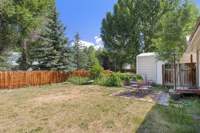 2646 Riverside Dr Unit A, Steamboat Springs, CO 80487 - fenced backyard featuring a patio and a shed