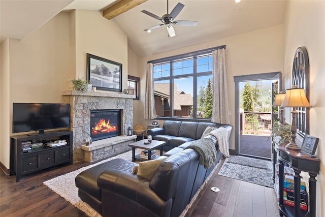799 Independence Rd Unit 799, Keystone, CO 80435 - living area featuring beam ceiling, dark wood finished floors, high vaulted ceiling, a stone fireplace, and ceiling fan