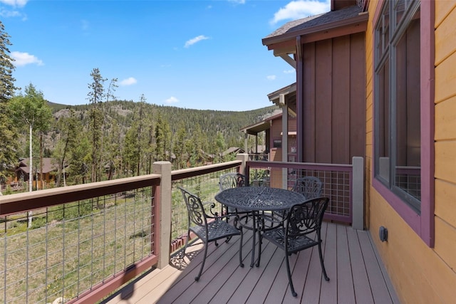799 Independence Rd Unit 799, Keystone, CO 80435 - deck featuring a forest view and outdoor dining area