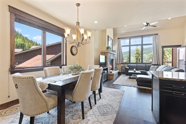 799 Independence Rd Unit 799, Keystone, CO 80435 - dining space with a chandelier, hardwood / wood-style floors, ceiling fan, recessed lighting, and a lit fireplace