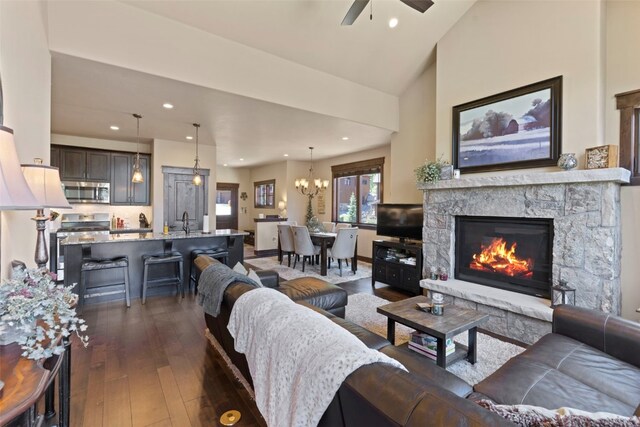 799 Independence Rd Unit 799, Keystone, CO 80435 - living area with dark wood-style floors, ceiling fan, a chandelier, recessed lighting, and a fireplace