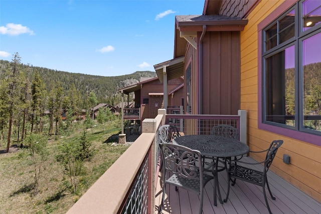 799 Independence Rd Unit 799, Keystone, CO 80435 - deck featuring a wooded view and outdoor dining area