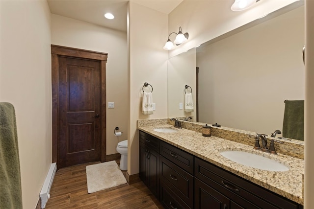 799 Independence Rd Unit 799, Keystone, CO 80435 - full bath featuring a baseboard radiator, double vanity, wood finished floors, and recessed lighting