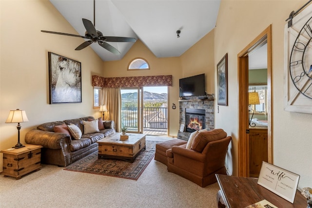 1660 Lakeview Ter Unit 306F, Frisco, CO 80443 - carpeted living area with a fireplace, high vaulted ceiling, and a ceiling fan