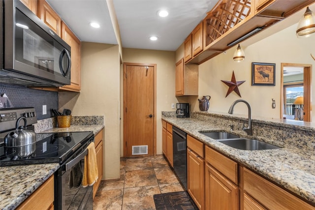 1660 Lakeview Ter Unit 306F, Frisco, CO 80443 - kitchen with black appliances, a sink, stone finish flooring, light stone counters, and recessed lighting