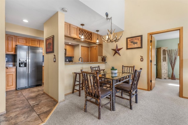 1660 Lakeview Ter Unit 306F, Frisco, CO 80443 - dining room with a chandelier, baseboards, carpet, and recessed lighting