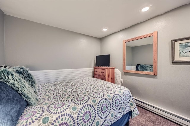 bedroom with a baseboard heating unit, carpet floors, and recessed lighting