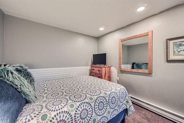 111 Corinthian Cir Unit D, Dillon, CO 80435 - bedroom with a baseboard heating unit, carpet floors, and recessed lighting