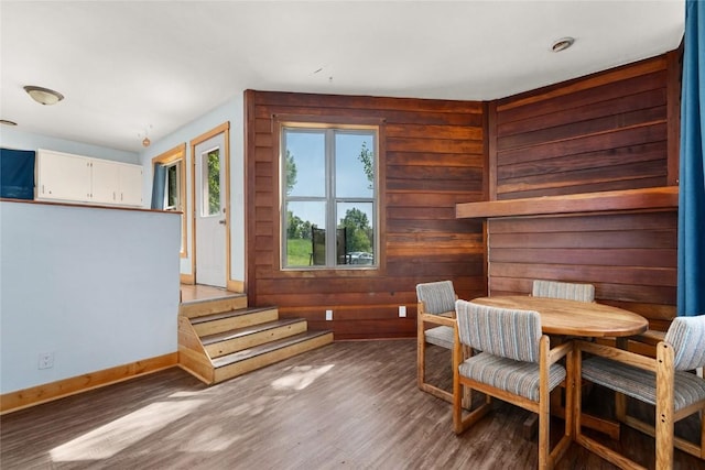 2495/2497 Val Disere Cir, Steamboat Springs, CO 80487 - dining room featuring wood finished floors, wooden walls, and stairs