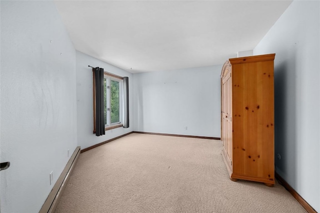 2495/2497 Val Disere Cir, Steamboat Springs, CO 80487 - empty room featuring a baseboard heating unit and light carpet