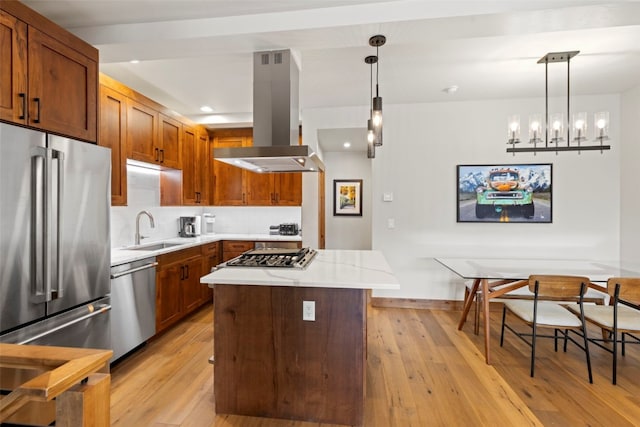 317 Granite St Unit 3, Frisco, CO 80443 - kitchen with appliances with stainless steel finishes, a sink, island exhaust hood, light wood-type flooring, and recessed lighting