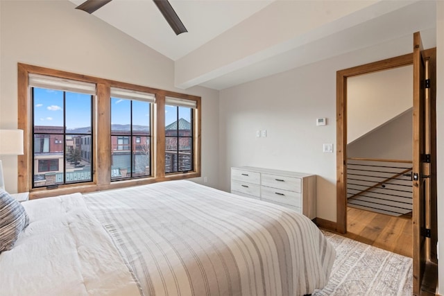 317 Granite St Unit 3, Frisco, CO 80443 - bedroom featuring vaulted ceiling, light wood-style floors, a ceiling fan, and baseboards