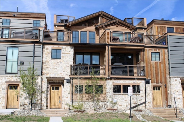 317 Granite St Unit 3, Frisco, CO 80443 - view of front facade with a balcony and stone siding