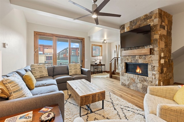 317 Granite St Unit 3, Frisco, CO 80443 - living room featuring wood finished floors, a ceiling fan, and a fireplace