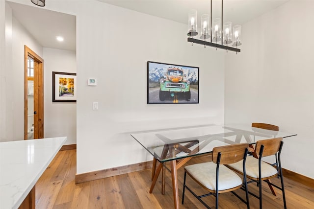 317 Granite St Unit 3, Frisco, CO 80443 - dining area with baseboards, hardwood / wood-style flooring, a chandelier, and recessed lighting