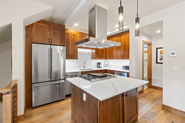 317 Granite St Unit 3, Frisco, CO 80443 - kitchen with appliances with stainless steel finishes, island exhaust hood, a sink, light wood finished floors, and baseboards