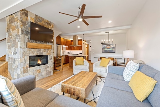 317 Granite St Unit 3, Frisco, CO 80443 - living room with light wood-style flooring, a ceiling fan, a fireplace, and recessed lighting