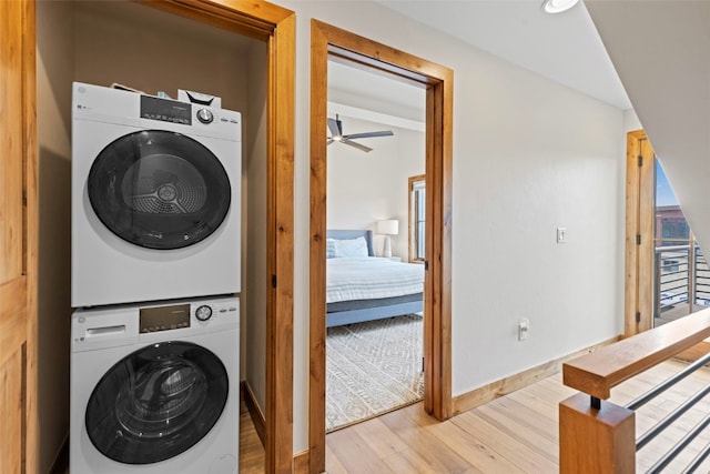 317 Granite St Unit 3, Frisco, CO 80443 - laundry room featuring stacked washing machine and dryer, wood finished floors, baseboards, and a ceiling fan