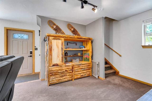 216 Ambush Ln, Jefferson, CO 80456 - carpeted living room featuring baseboards and stairs